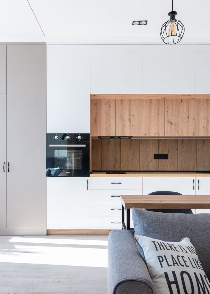 room with open kitchen near sofa